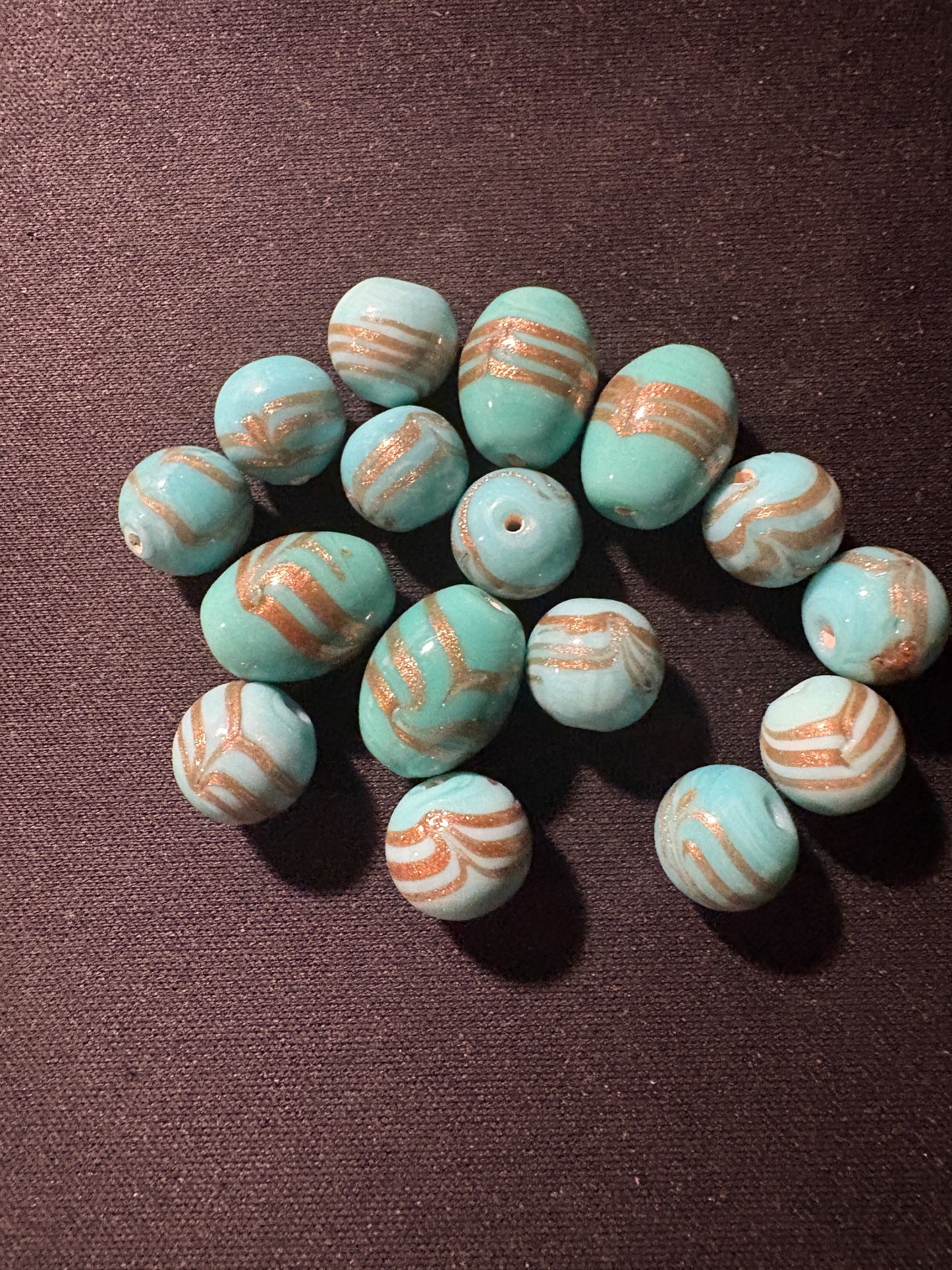 16 turquoise gold swirl matched glass beads (S304)- Fancy- 10-15mm